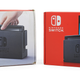 The original Switch packaging is on the left, the new one is in red on the right.